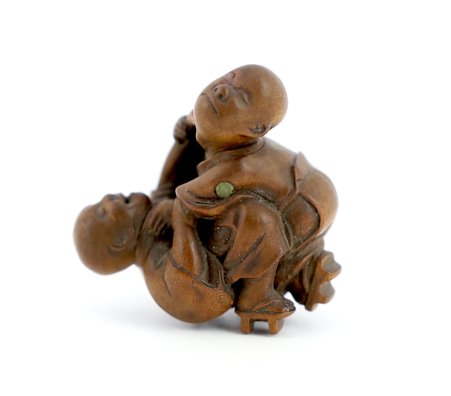 A Tokyo School carved wood netsuke of two boys fighting, 19th century, signed Kakiman